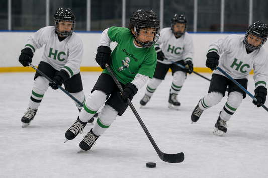Boy playing ice-hockey indoors wearing Huey Chewy green ice hockey t-shirt