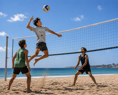 Boy playing volleyball at the beach with friends wearing Huey Chewy light grey volleyball t-shirt